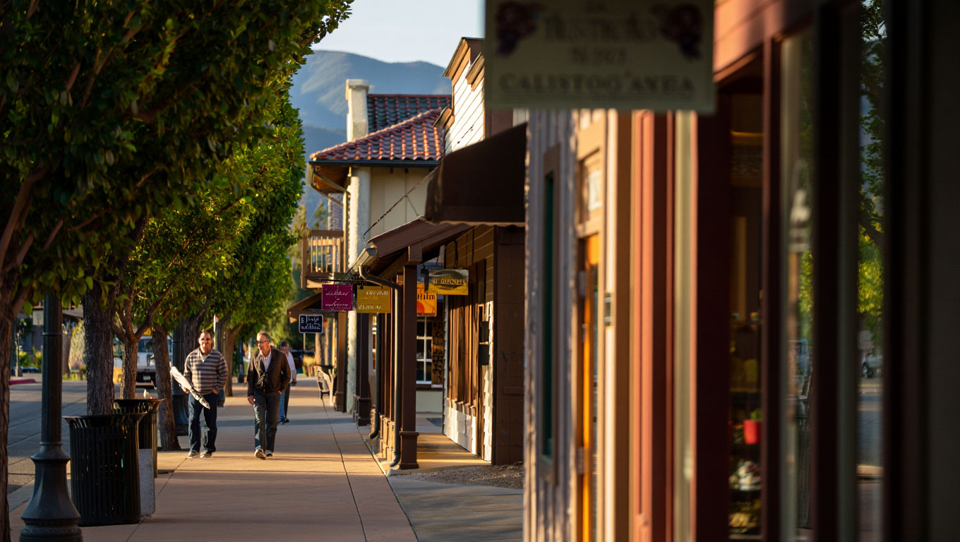 Quiet downtown Calistoga street in the late afternoon with historic buildings, small shops, and minimal foot traffic.