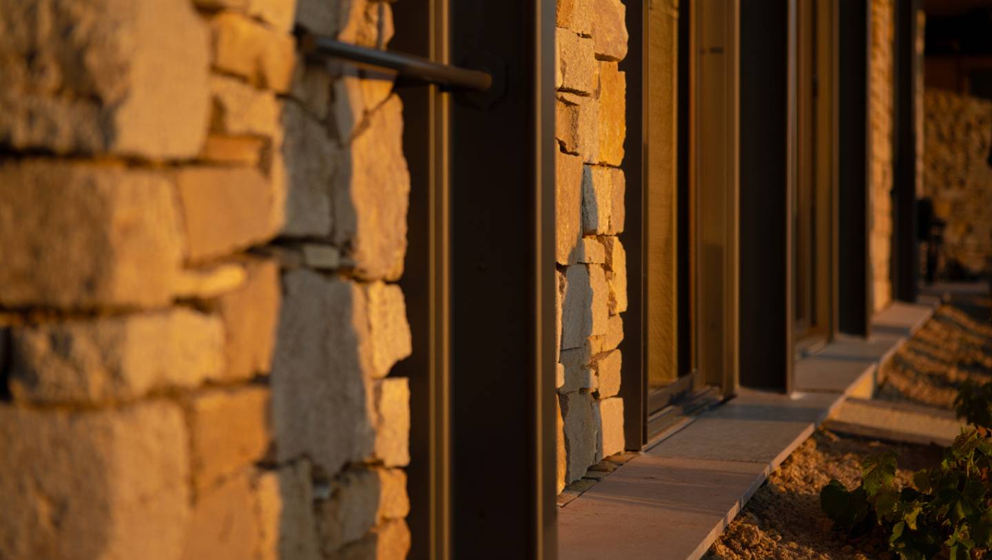 Close up of Napa Valley architecture materials including stone, steel, and natural light reflecting the region’s design style.