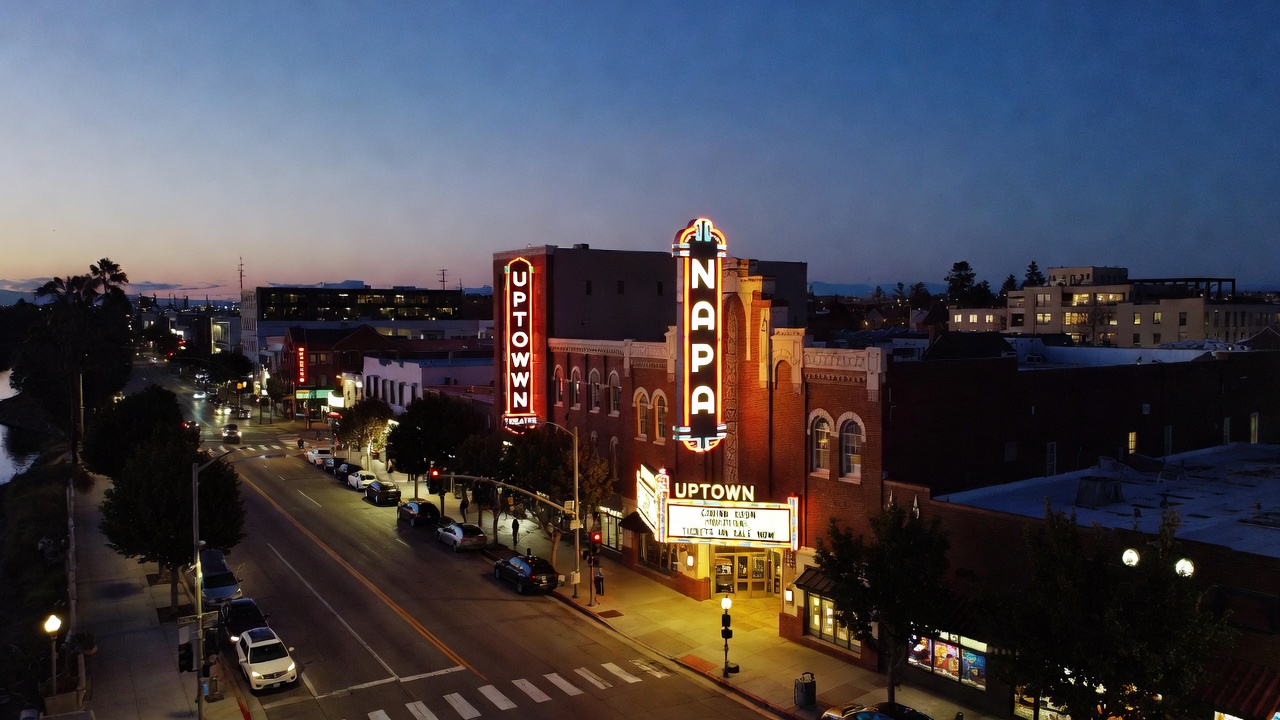 The Uptown Theatre in Downtown Napa at early evening, with soft lights, quiet streets, and a relaxed atmosphere reflecting Napa Valley’s intimate live music culture.