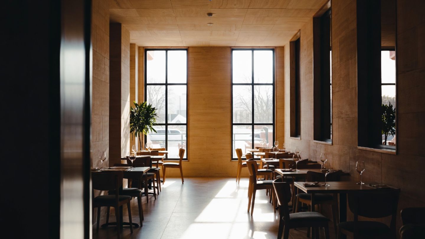 Interior breakfast room of a Napa Valley boutique hotel with natural light and warm design, showing a quiet morning atmosphere for a relaxed wine country stay.