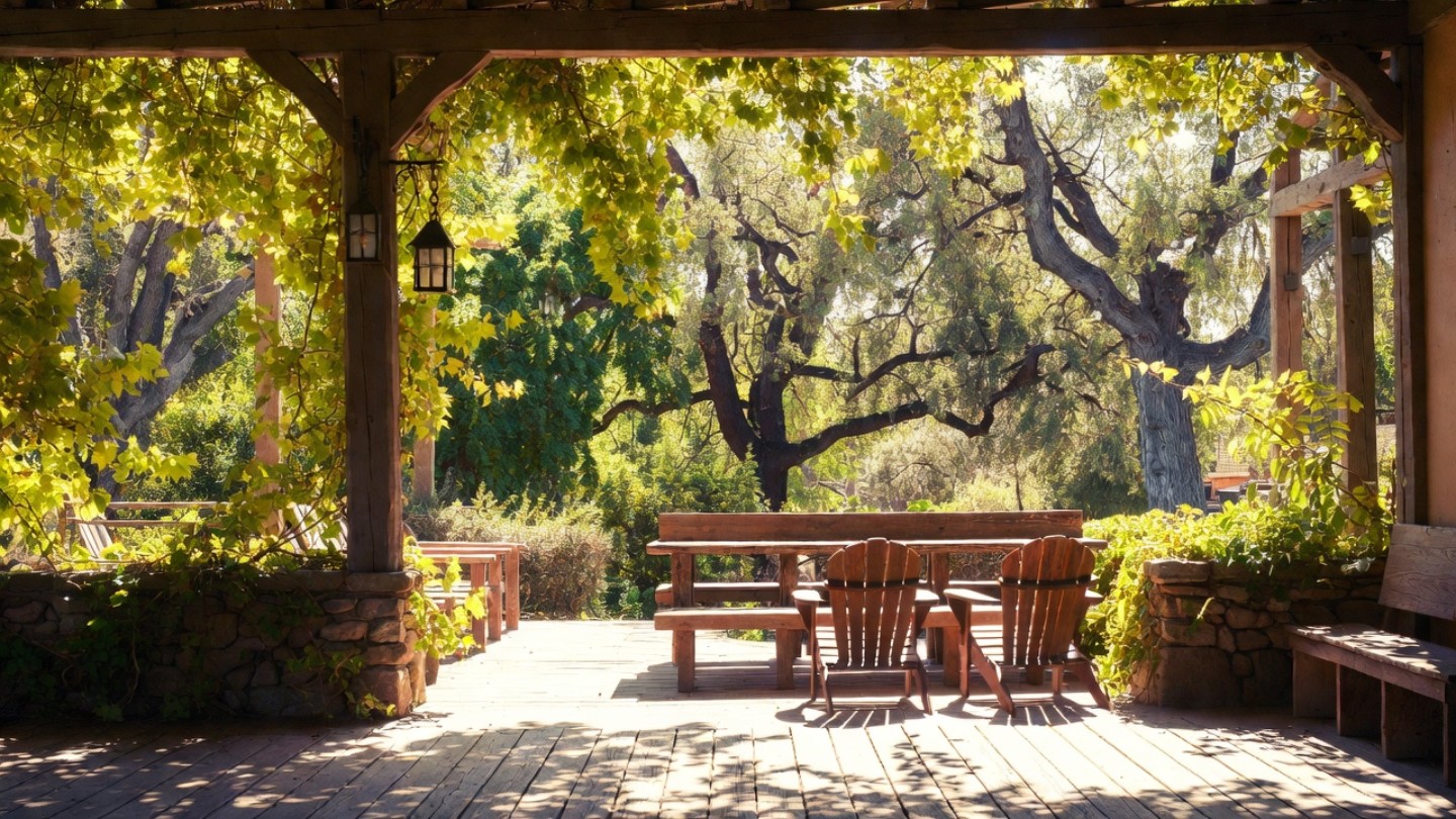 Garden courtyard at a historic Napa Valley inn with mature landscaping and seating, showing the quiet atmosphere valued by historic hotel seekers from Marin County.
