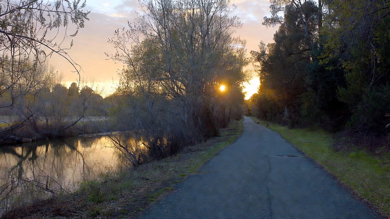 Sunrise along the Napa River Trail with a peaceful walking path and soft light, ideal for mindful walks and slow living travel.