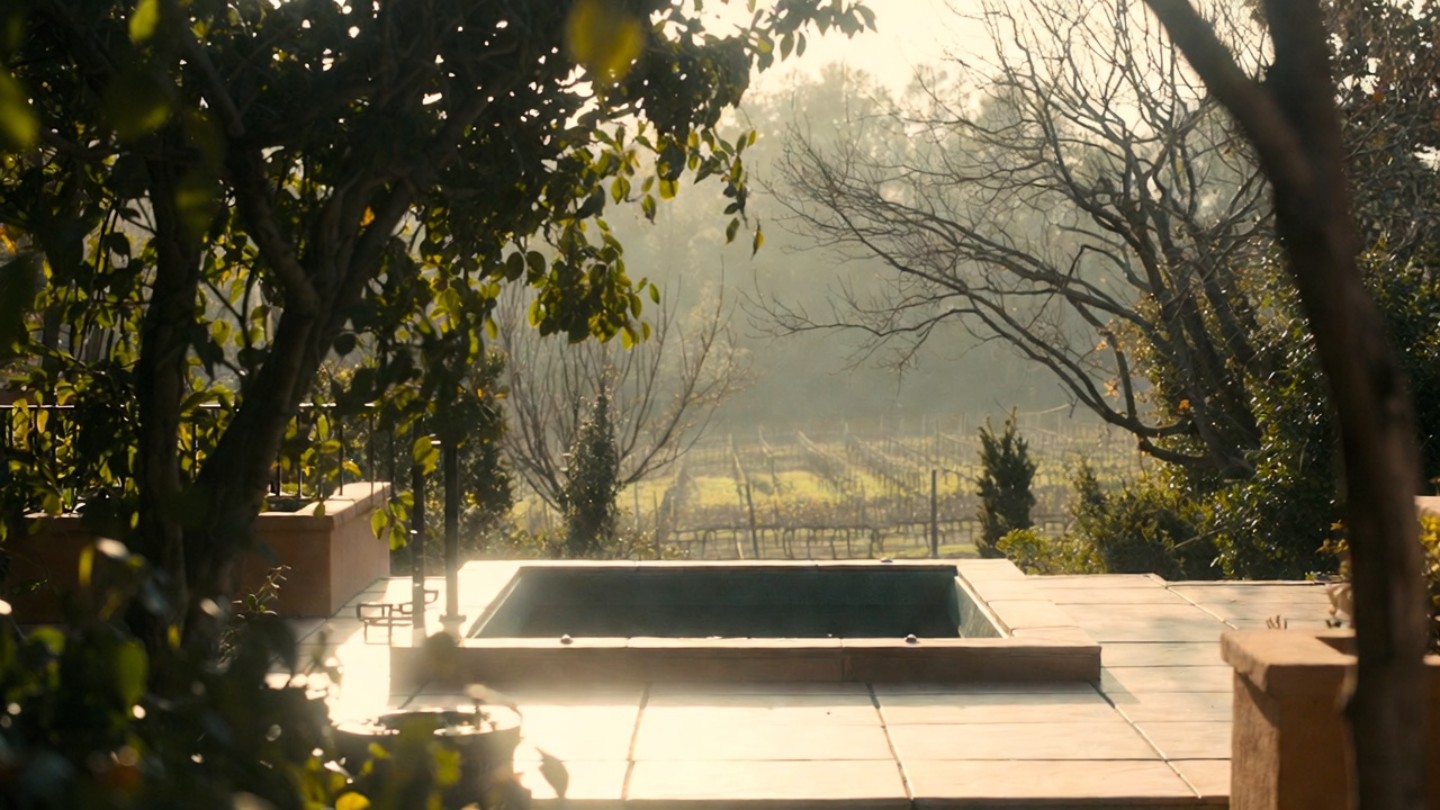 Private outdoor soaking tub and patio at a secluded Napa Valley cottage surrounded by garden greenery, ideal for couples planning a quiet honeymoon from Marin County.