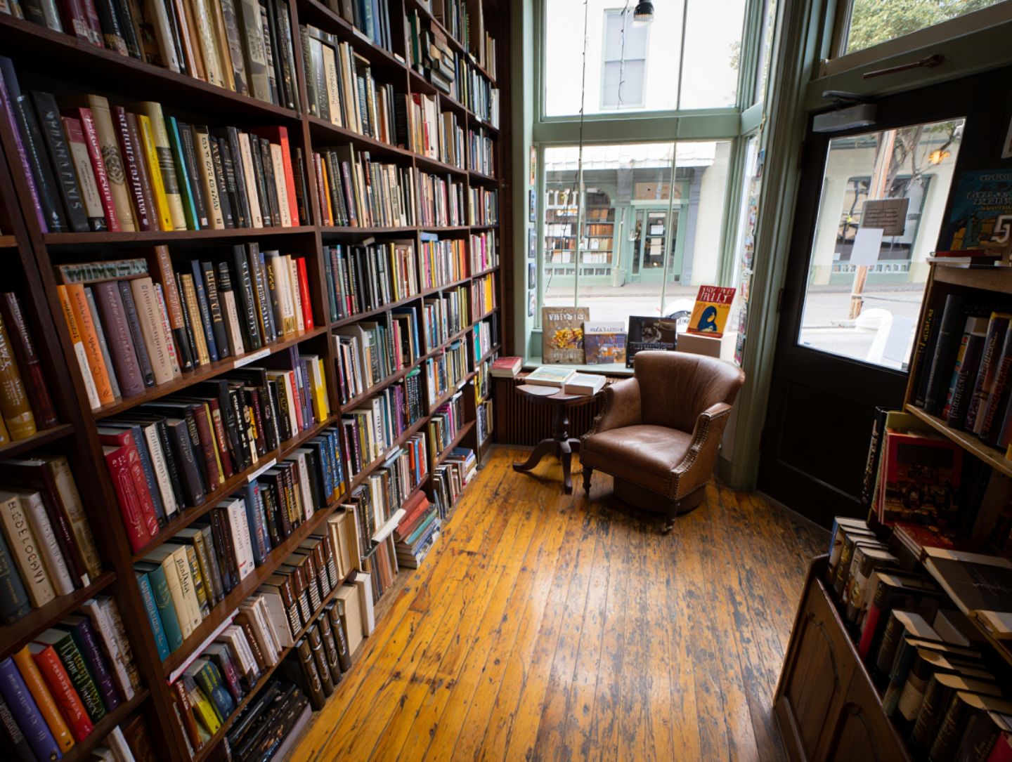 Independent bookstore in St. Helena Napa Valley with wooden shelves of wine and regional books and natural light illuminating a quiet reading nook.